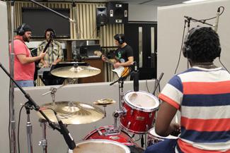 Music band practice in studio hall